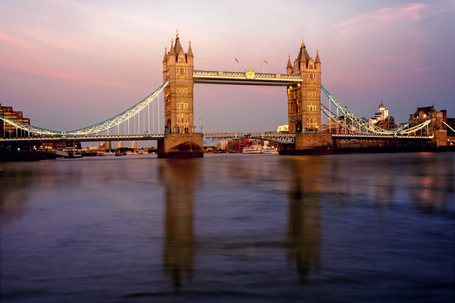 Tower Bridge illuminated at dusk over the River Thames